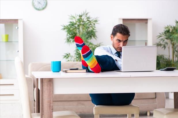 employee working from home with feet up
