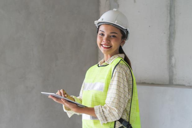 female construction worker with clipboard
