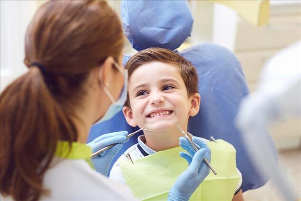 Dentist with a child patient