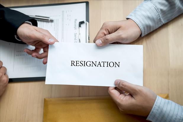 Employee handing in resignation letter