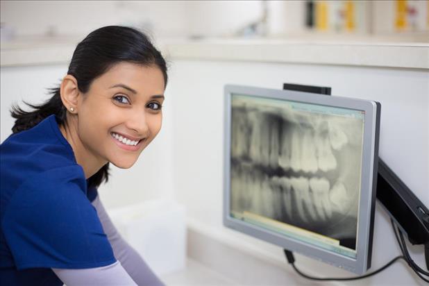 dental assistant taking an x-ray