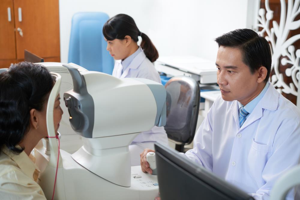 Chinese-American optometrist examining patient