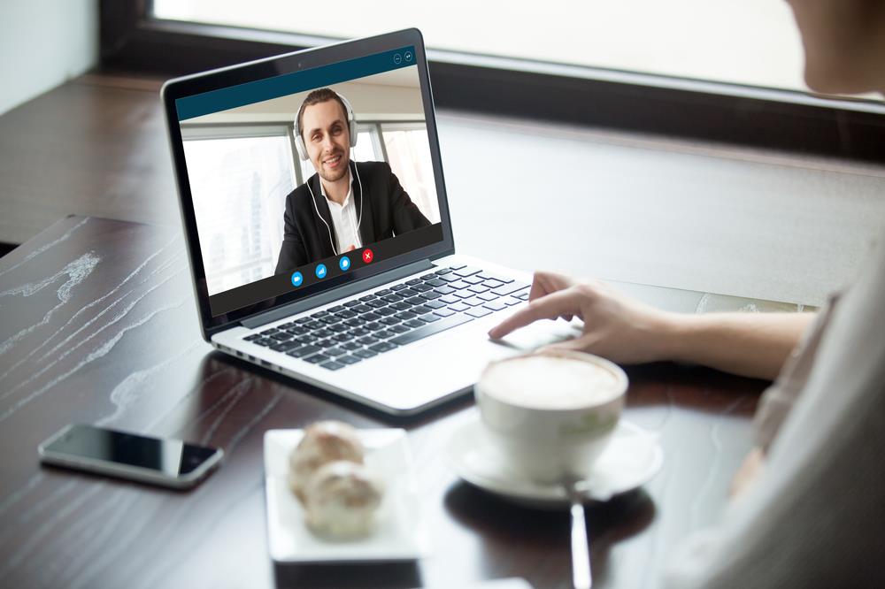 Two remote employees having a video call