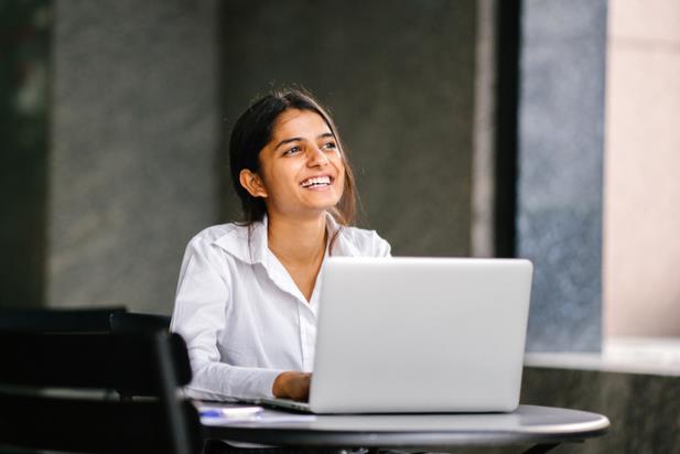 woman looking up from computer