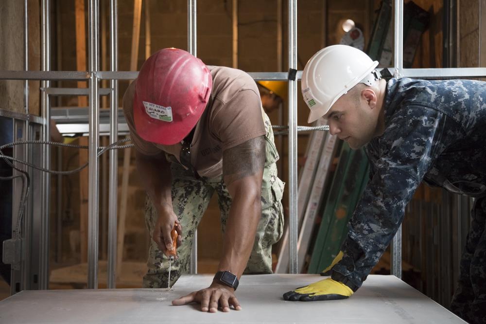 Military men doing construction job