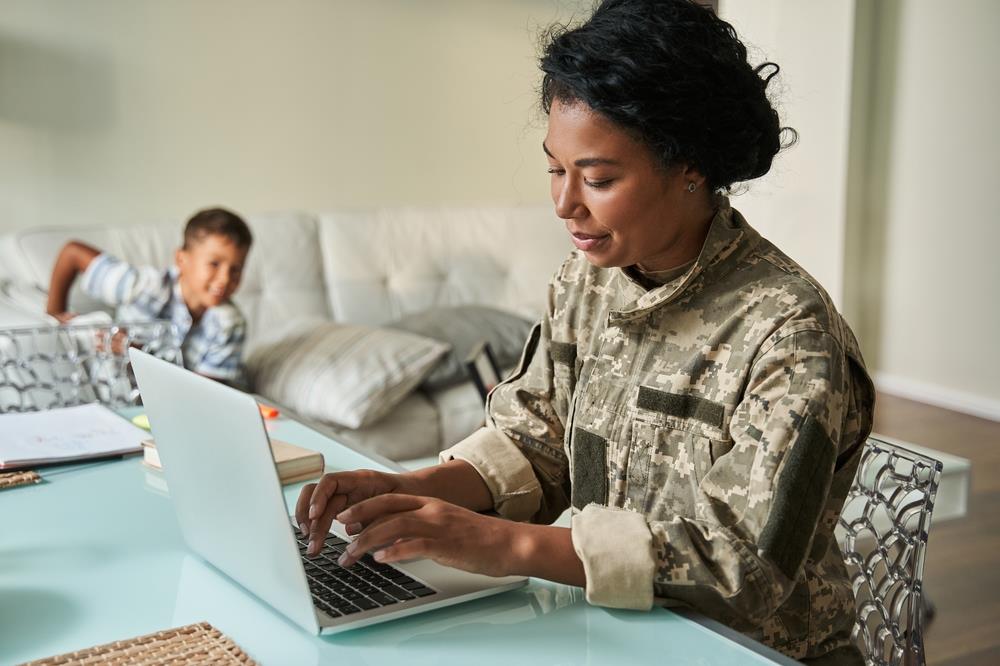 Military woman using laptop