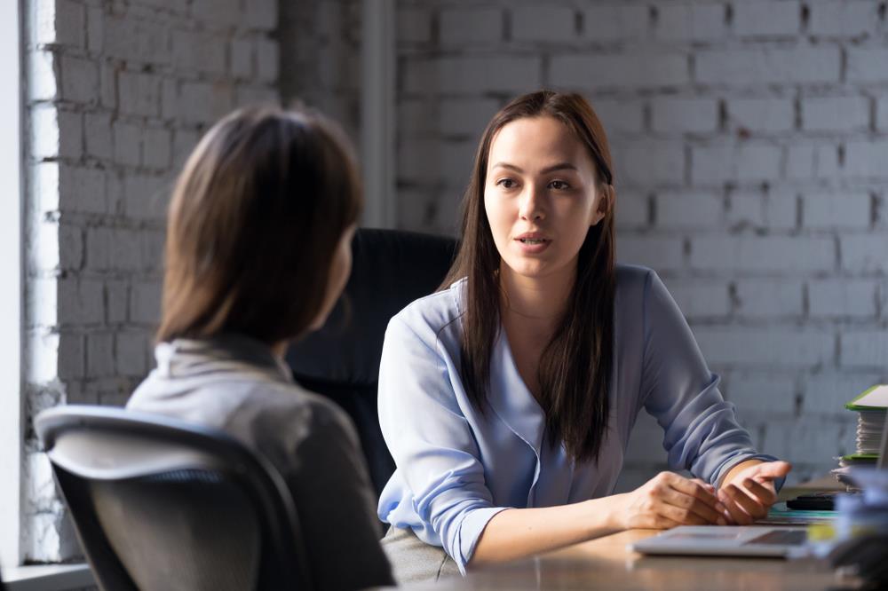 Hiring manager giving feedback to recruiter