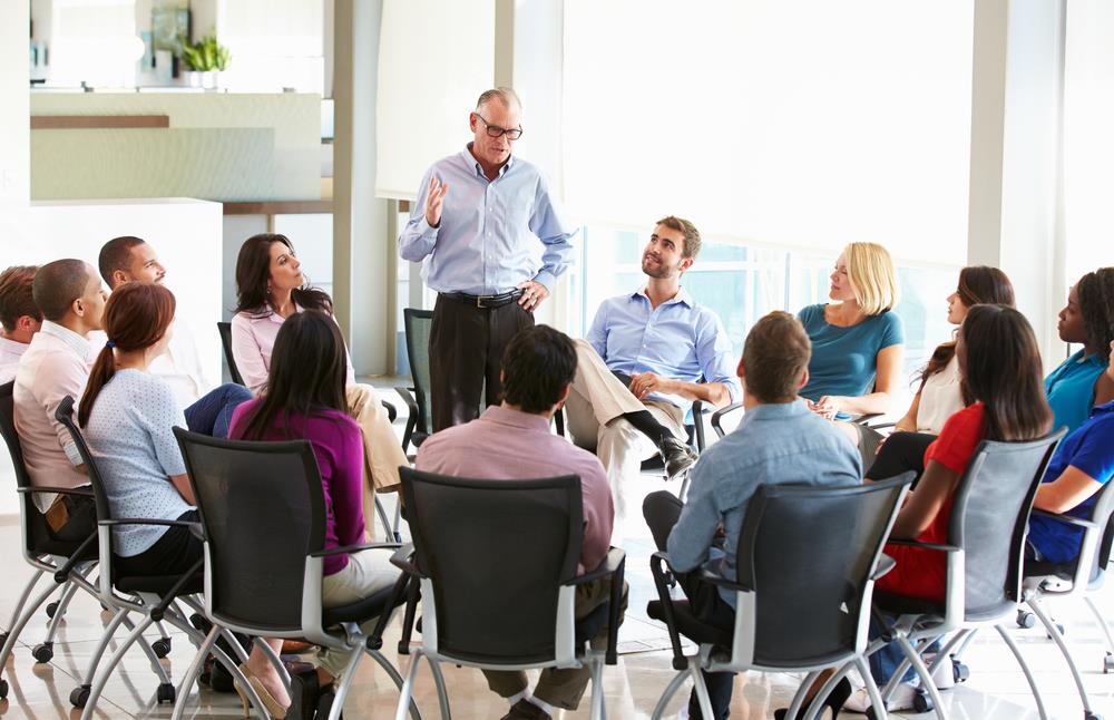 Interviewer guiding discussion during group interview
