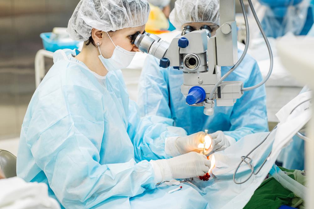 ophthalmologist and ophthalmic technician performing surgery