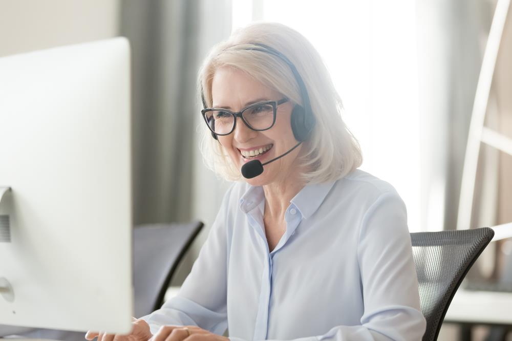 salesperson making client calls at her desk