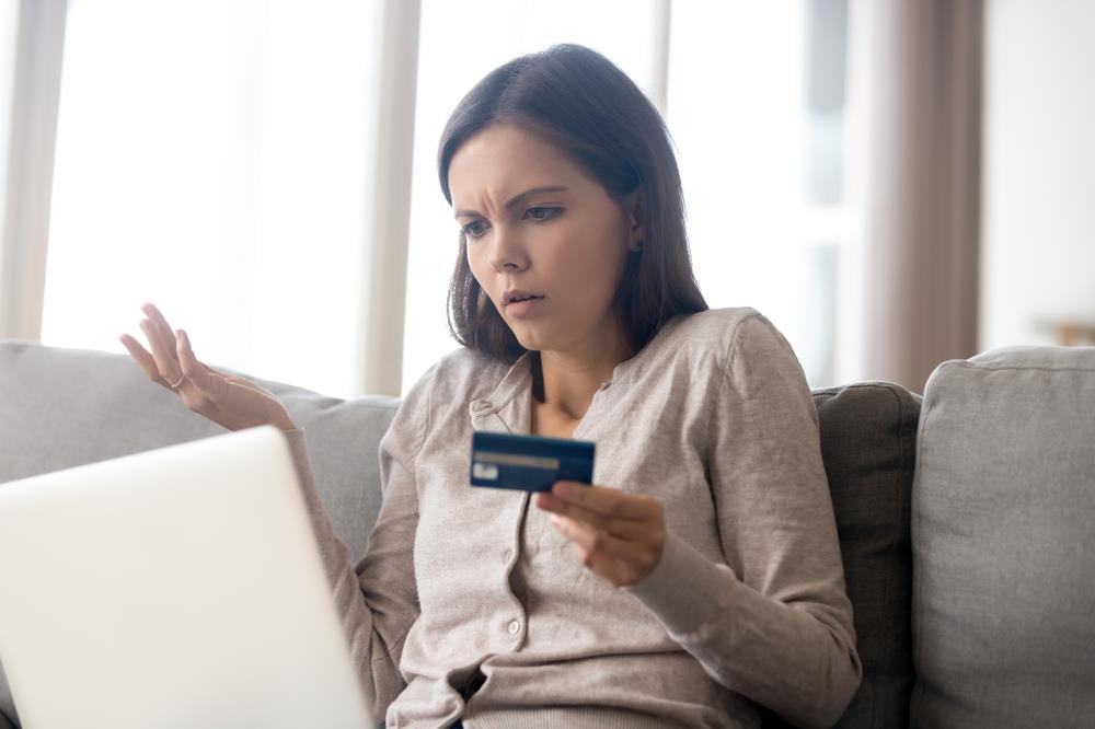 Confused job seeker submitting credit card information online