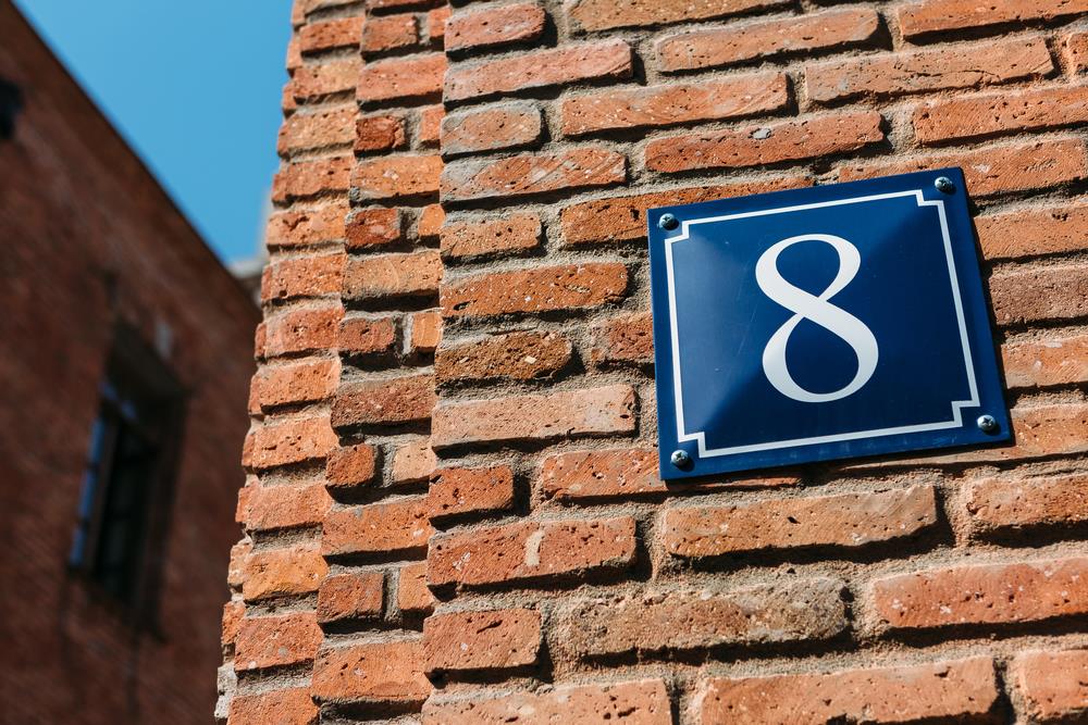 number 8 on a brick wall