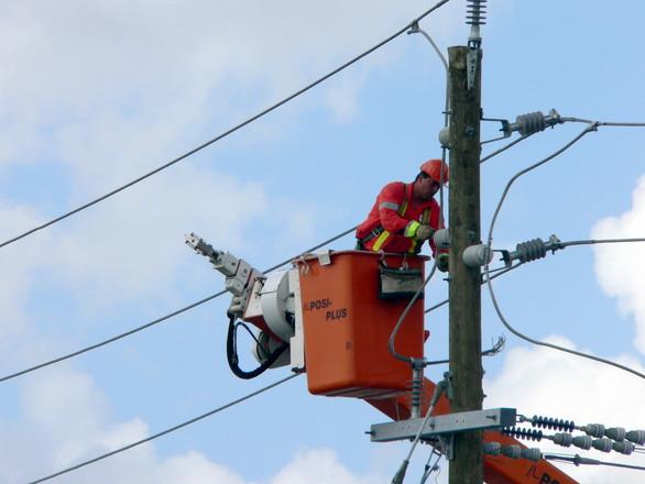 Lineman working on a utility pole