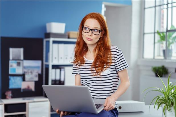 passive candidate looking at her computer thinking about a new job